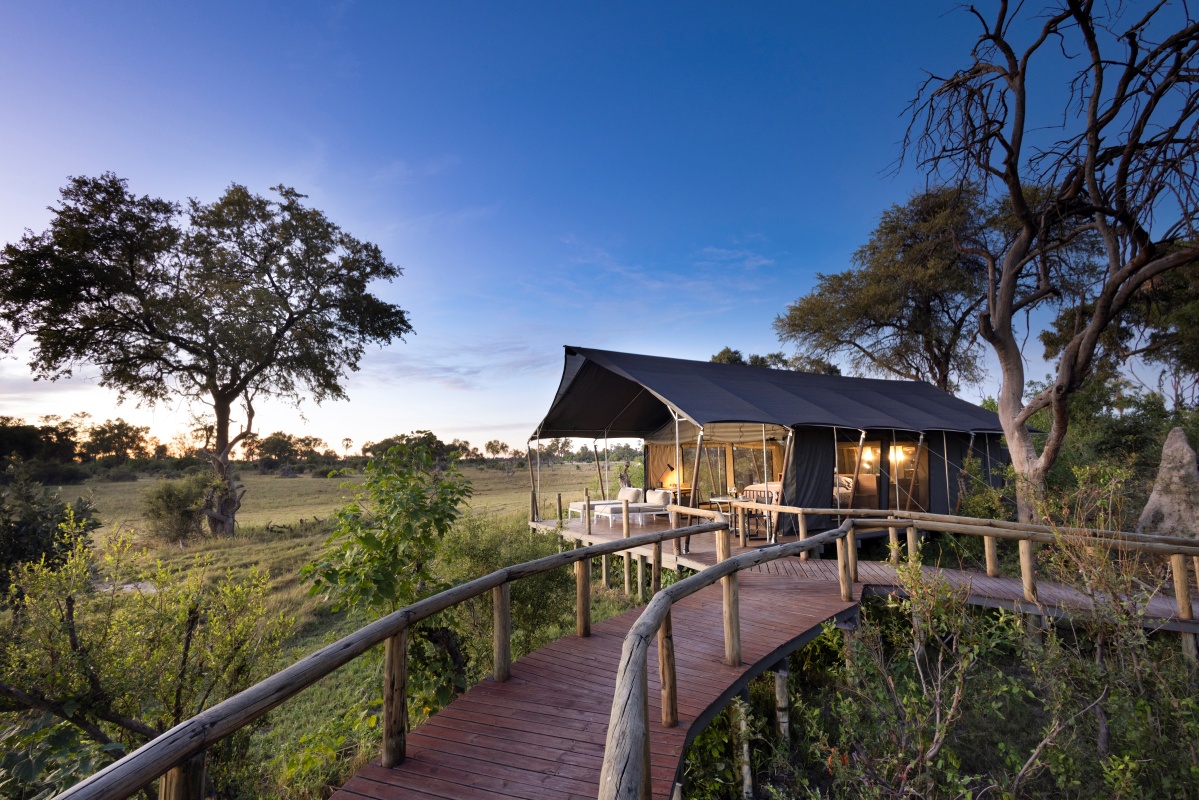 Gomoti Private Botswana - Luxury Tent Walkway Sunset